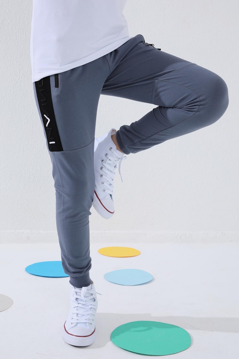 Tommy Life Petrol Erkek Çocuk Yazı Nakışlı Yarım Şeritli Jogger Dar Kalıp Manşetli Eşofman Alt - 64050. 11 Tommy Life Petrol Erkek Çocuk Yazı Nakışlı Yarım Şeritli Jogger Dar Kalıp Manşetli Eşofman Alt - 64050. 11